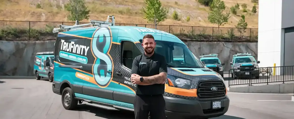 TruFinity team with branded service vehicles
